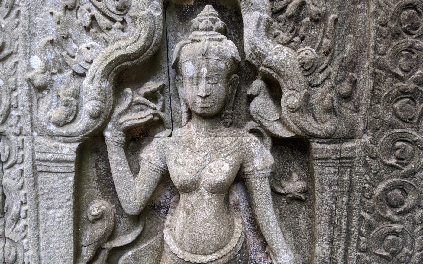 A carved female figure in temple sandstone